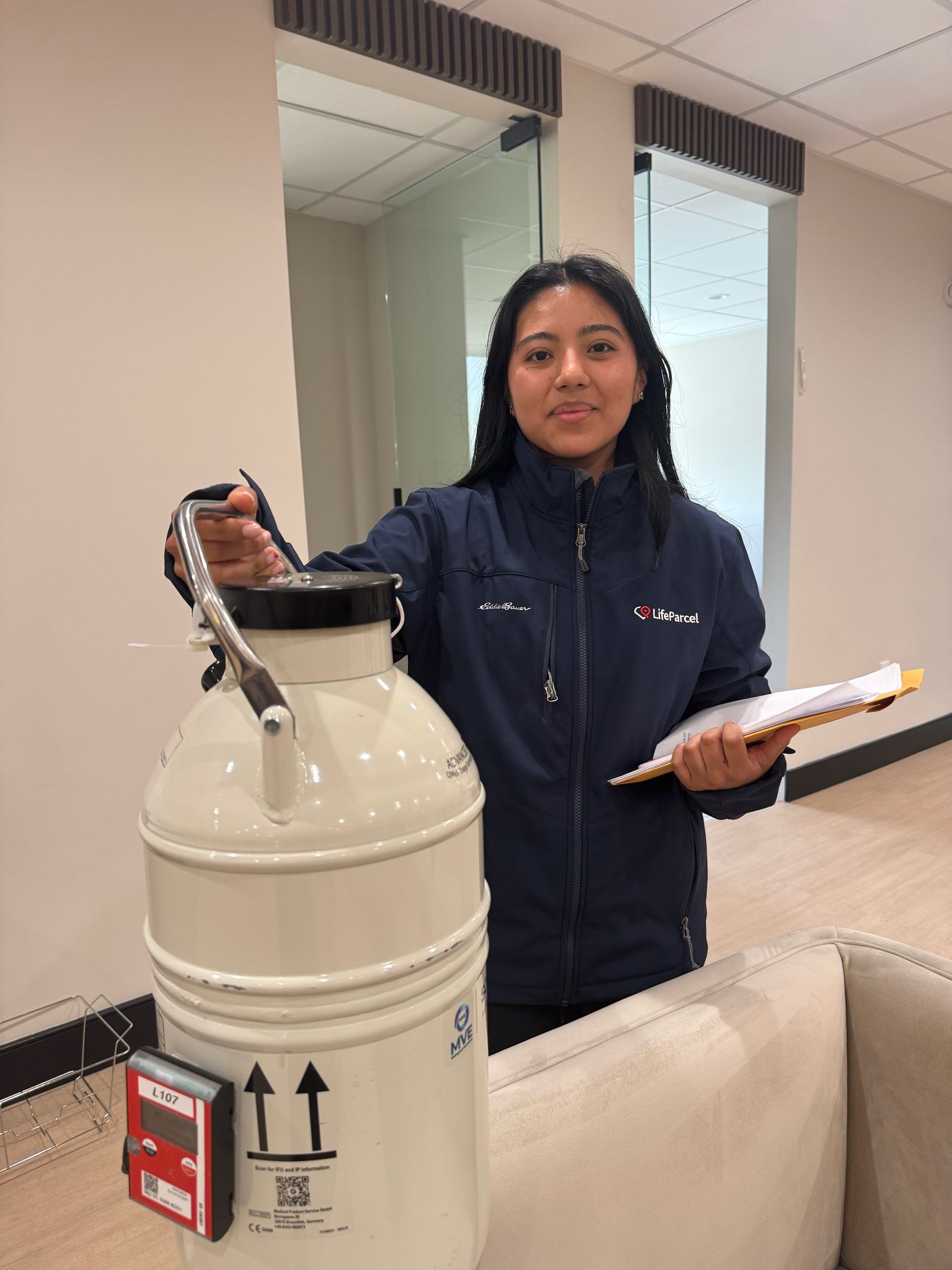 LifeParcel courier holds a cryotank preparing for a mission