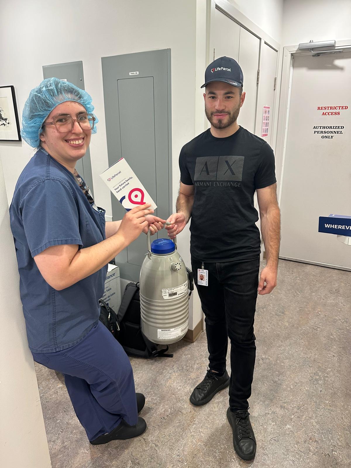 LifeParcel courier at a clinic holding a cryoshipper, beginning the IVF shipping chain of custody process